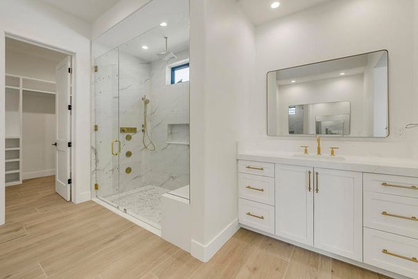 Bathroom, Glass Shower, Interior, Marble Walls, Recessed Lighting, Wood Texture Flooring