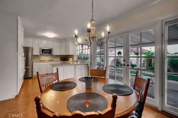 Chandelier, Dining room, Interior, Kitchen, Stainless Steel Appliances, Wood Texture Flooring