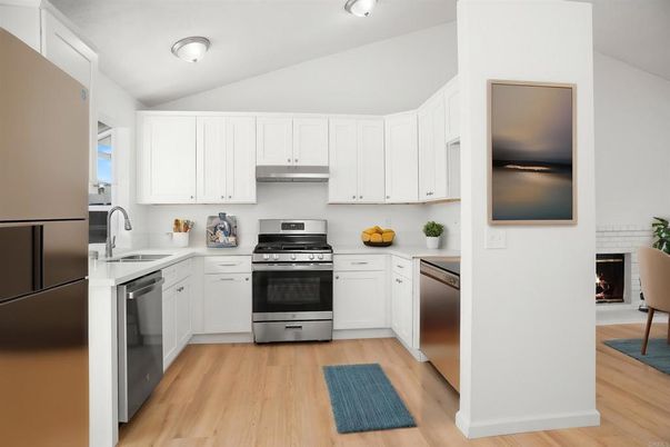 Fireplace, Interior, Kitchen, Stainless Steel Appliances, Wood Texture Flooring