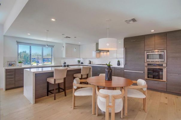 Dining room, Interior, Kitchen, Pendant Lights, Recessed Lighting, Stainless Steel Appliances, Wood Texture Flooring