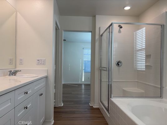 Bathroom, Dual Sink Vanities, Glass Shower, Interior, Recessed Lighting, Wood Texture Flooring