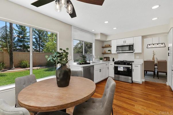 Dining room, Interior, Kitchen, Pendant Lights, Recessed Lighting, Stainless Steel Appliances, Wood Texture Flooring