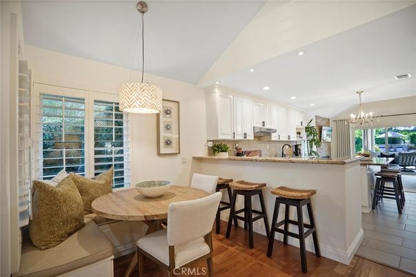 Chandelier, Dining room, Interior, Kitchen, Pendant Lights, Recessed Lighting, Stainless Steel Appliances, Wood Texture Flooring