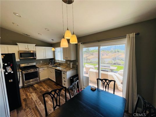Dining room, Interior, Kitchen, Pendant Lights, Recessed Lighting, Stainless Steel Appliances, Wood Texture Flooring