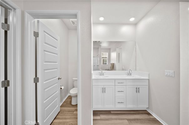 Bathroom, Dual Sink Vanities, Interior, Recessed Lighting, Wood Texture Flooring