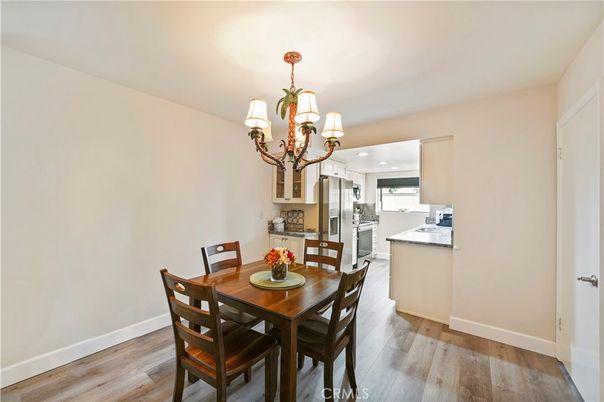 Chandelier, Dining room, Interior, Kitchen, Recessed Lighting, Stainless Steel Appliances, Wood Texture Flooring