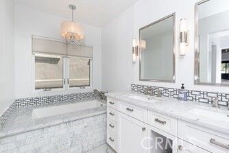 Bathroom, Chandelier, Dual Sink Vanities, Interior, Marble, Pendant Lights