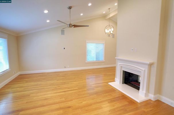 Chandelier, Empty room, Fireplace, Interior, Pendant Lights, Recessed Lighting, Wood Texture Flooring