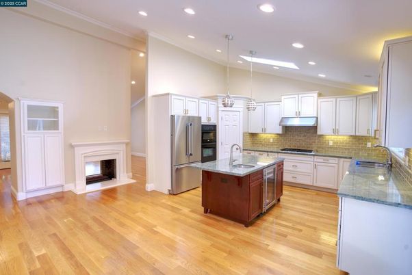 Fireplace, Interior, Kitchen, Pendant Lights, Recessed Lighting, Stainless Steel Appliances, Wood Texture Flooring