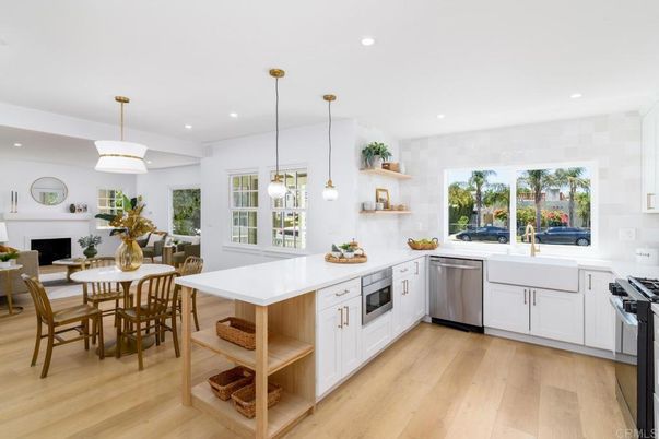 Dining room, Fireplace, Interior, Kitchen, Pendant Lights, Recessed Lighting, Stainless Steel Appliances, Wood Texture Flooring