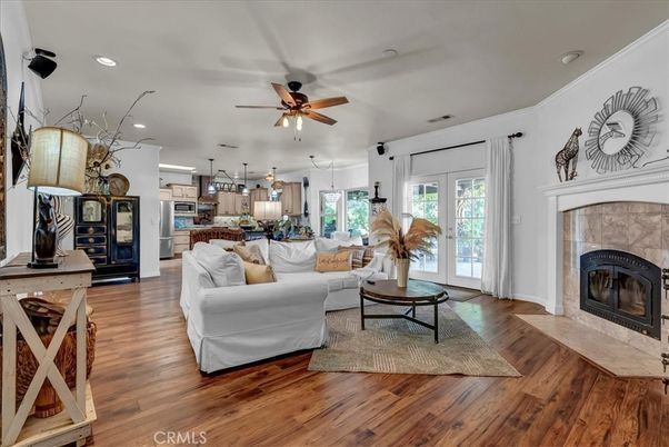 Fireplace, Interior, Kitchen, Living room, Pendant Lights, Recessed Lighting, Stainless Steel Appliances, Wood Texture Flooring