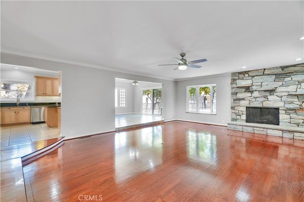 Empty room, Fireplace, Interior, Kitchen, Recessed Lighting, Stone Walls, Wood Texture Flooring