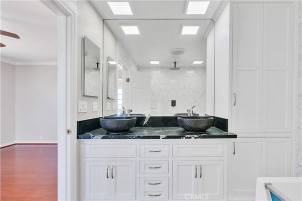 Bathroom, Dual Sink Vanities, Interior, Marble Walls, Wood Texture Flooring