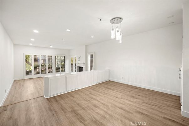 Empty room, Fireplace, Interior, Pendant Lights, Recessed Lighting, Wood Texture Flooring