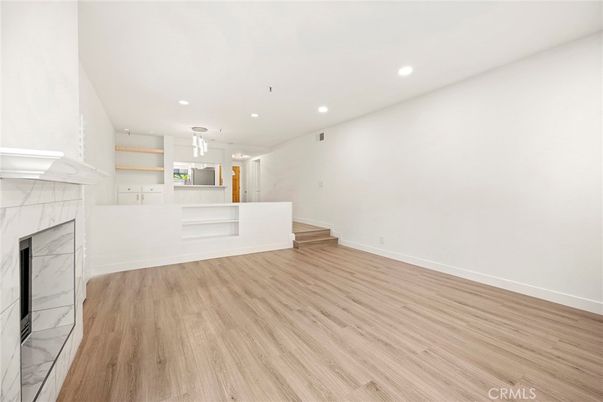 Empty room, Fireplace, Interior, Pendant Lights, Recessed Lighting, Wood Texture Flooring