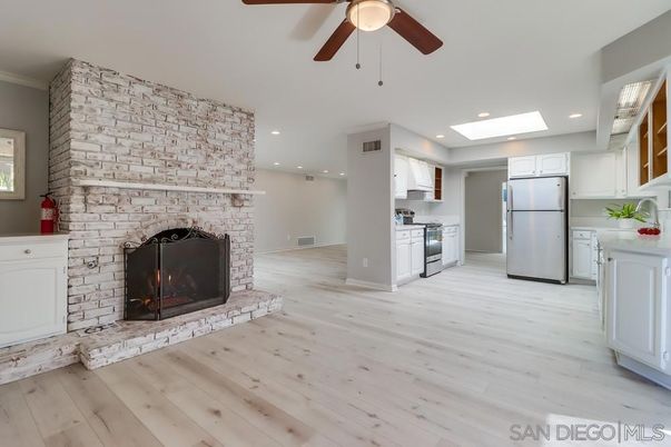 Fireplace, Interior, Kitchen, Recessed Lighting, Stone Walls, Wood Texture Flooring