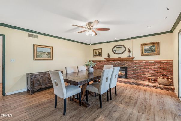 Dining room, Fireplace, Interior, Recessed Lighting, Stone Walls, Wood Texture Flooring