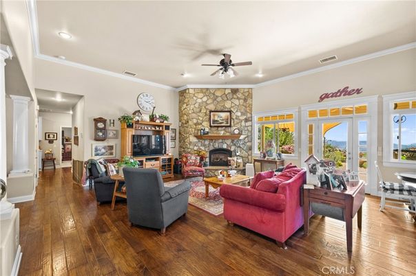 Fireplace, Interior, Living room, Recessed Lighting, Stone Walls, Wood Texture Flooring