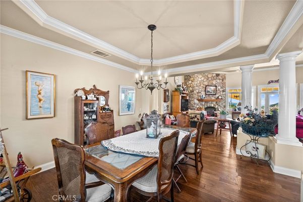 Chandelier, Dining room, Fireplace, Interior, Pendant Lights, Stone Walls, Wood Texture Flooring