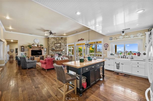 Dining room, Fireplace, Interior, Kitchen, Living room, Recessed Lighting, Stone Walls, Wood Texture Flooring