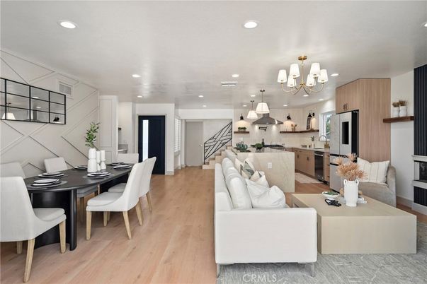 Chandelier, Dining room, Interior, Kitchen, Living room, Pendant Lights, Recessed Lighting, Stainless Steel Appliances, Wood Texture Flooring