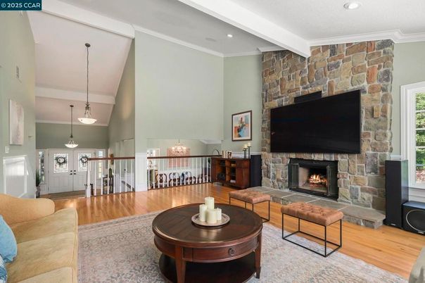 Chandelier, Dining room, Fireplace, Interior, Living room, Pendant Lights, Recessed Lighting, Stone Walls, Wood Texture Flooring