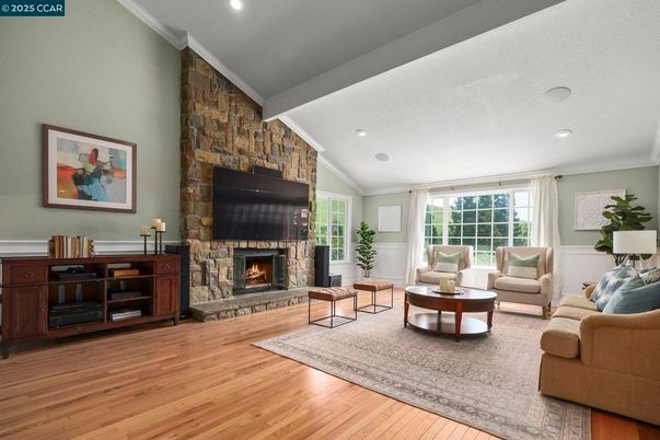 Fireplace, Interior, Living room, Recessed Lighting, Stone Walls, Wood Texture Flooring