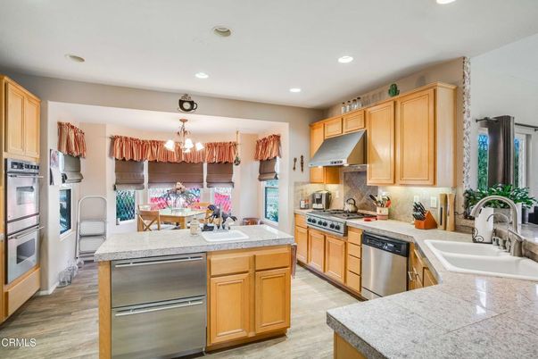Chandelier, Dining room, Interior, Kitchen, Pendant Lights, Recessed Lighting, Stainless Steel Appliances, Wood Texture Flooring