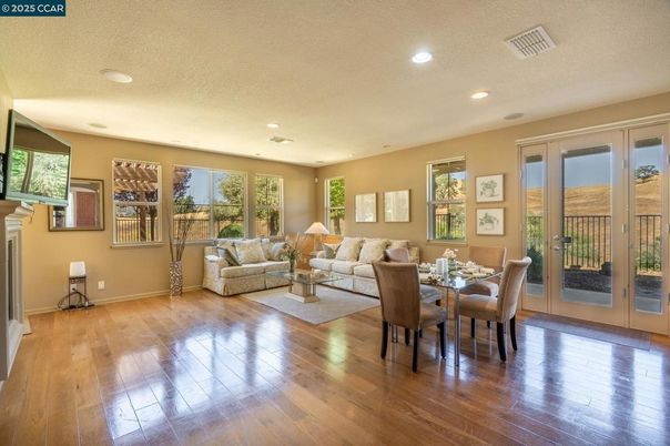 Dining room, Fireplace, Interior, Living room, Recessed Lighting, Wood Texture Flooring