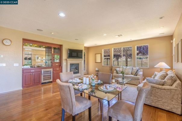 Dining room, Fireplace, Interior, Living room, Recessed Lighting, Wood Texture Flooring