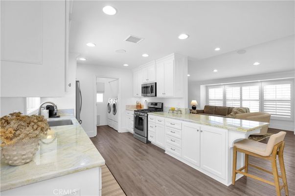 Interior, Kitchen, Living room, Recessed Lighting, Stainless Steel Appliances, Washer, Wood Texture Flooring