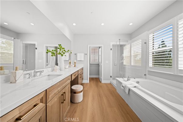 Bathroom, Dual Sink Vanities, Glass Shower, Interior, Recessed Lighting, Wood Texture Flooring