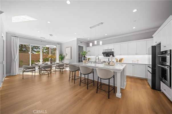 Dining room, Interior, Kitchen, Pendant Lights, Recessed Lighting, Stainless Steel Appliances, Wood Texture Flooring