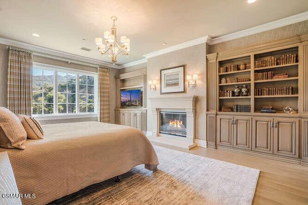 Bedroom, Chandelier, Fireplace, Interior, Recessed Lighting, Wood Texture Flooring