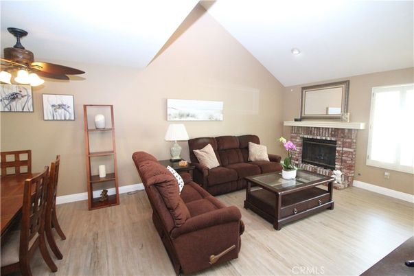 Dining room, Fireplace, Interior, Living room, Recessed Lighting, Wood Texture Flooring