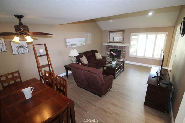 Dining room, Fireplace, Interior, Living room, Recessed Lighting, Wood Texture Flooring