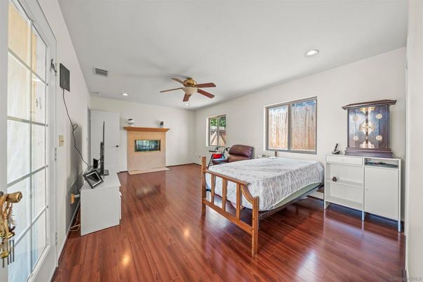 Bedroom, Fireplace, Interior, Recessed Lighting, Wood Texture Flooring
