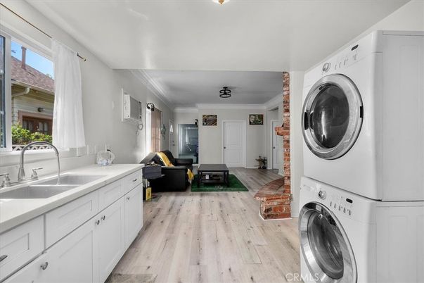 Interior, Living room, Utility Closets, Washer, Wood Texture Flooring
