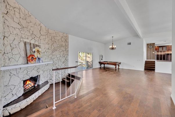 Billiard Table, Chandelier, Fireplace, Game Room, Interior, Stone Walls, Wood Texture Flooring