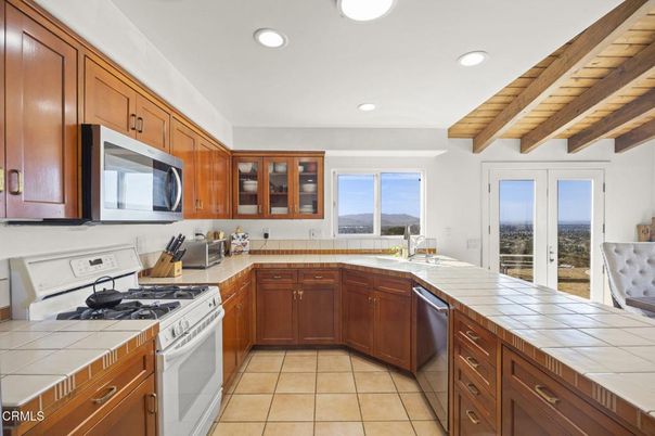 Interior, Kitchen, Recessed Lighting, Stainless Steel Appliances, Tile Countertops, Wooden Beams