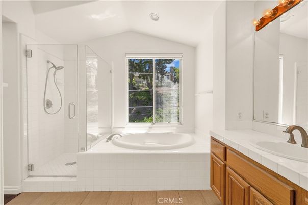 Bathroom, Glass Shower, Interior, Recessed Lighting, Tile Countertops, Wood Texture Flooring
