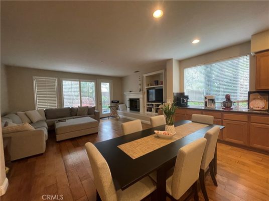 Dining room, Fireplace, Interior, Living room, Recessed Lighting, Wood Texture Flooring