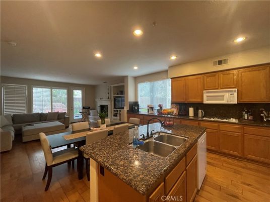 Dining room, Fireplace, Interior, Kitchen, Living room, Recessed Lighting, Wood Texture Flooring