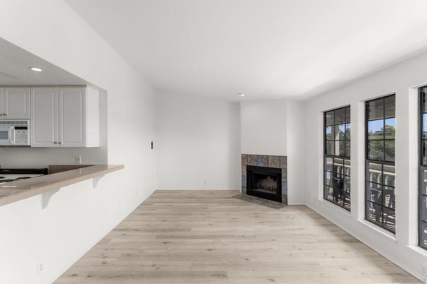 Empty room, Fireplace, Interior, Kitchen, Recessed Lighting, Wood Texture Flooring