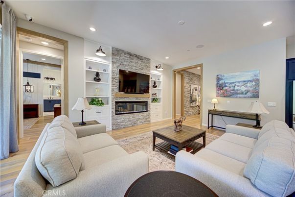 Fireplace, Interior, Living room, Recessed Lighting, Stone Walls, Wood Texture Flooring