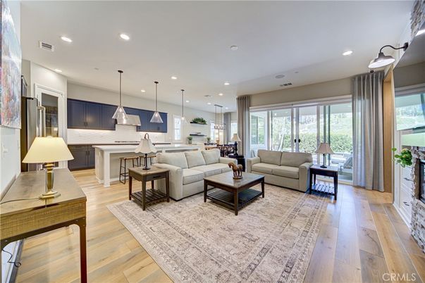 Fireplace, Interior, Kitchen, Living room, Pendant Lights, Recessed Lighting, Stainless Steel Appliances, Wood Texture Flooring