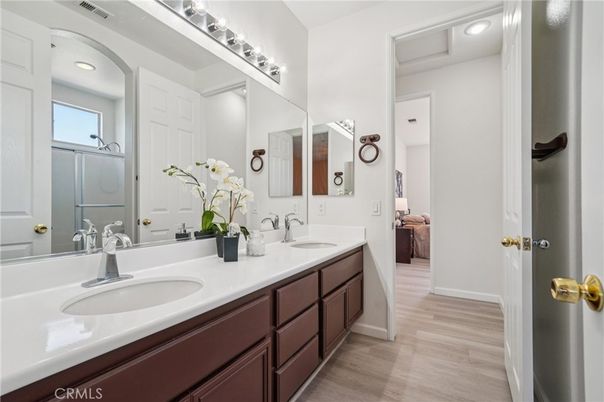 Bathroom, Dual Sink Vanities, Interior, Recessed Lighting, Wood Texture Flooring