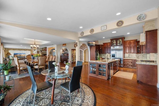 Chandelier, Dining room, Interior, Kitchen, Recessed Lighting, Stainless Steel Appliances, Wood Texture Flooring