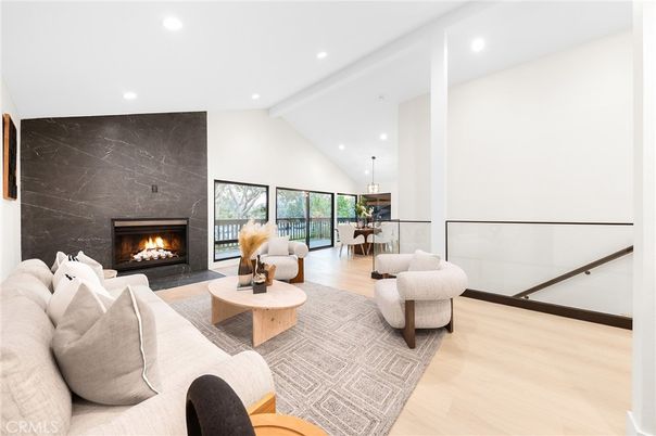 Dining room, Fireplace, Interior, Living room, Marble Walls, Pendant Lights, Recessed Lighting, Wood Texture Flooring