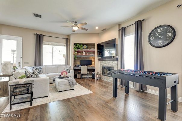 Fireplace, Game Room, Interior, Living room, Recessed Lighting, Wood Texture Flooring